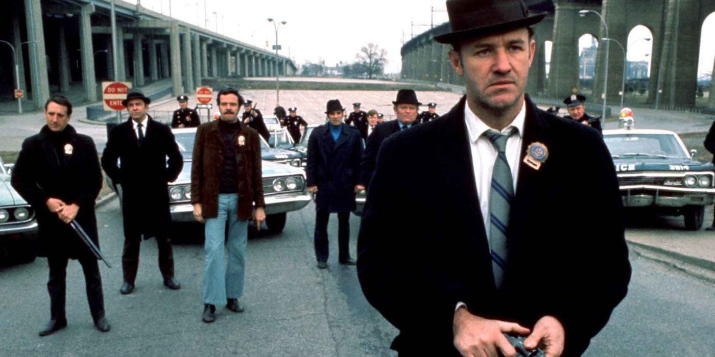 Gene Hackman stands with a group of police officers in The French Connection.