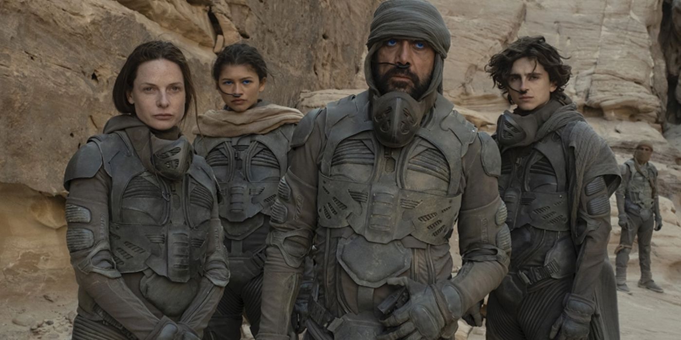 Characters from Dune stand in a Canyon
