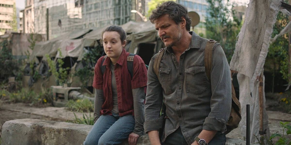 Ellie (played by Bella Ramsey) sits next to Joel (Pedro Pascal) in a scene from HBO's The Last of Us.