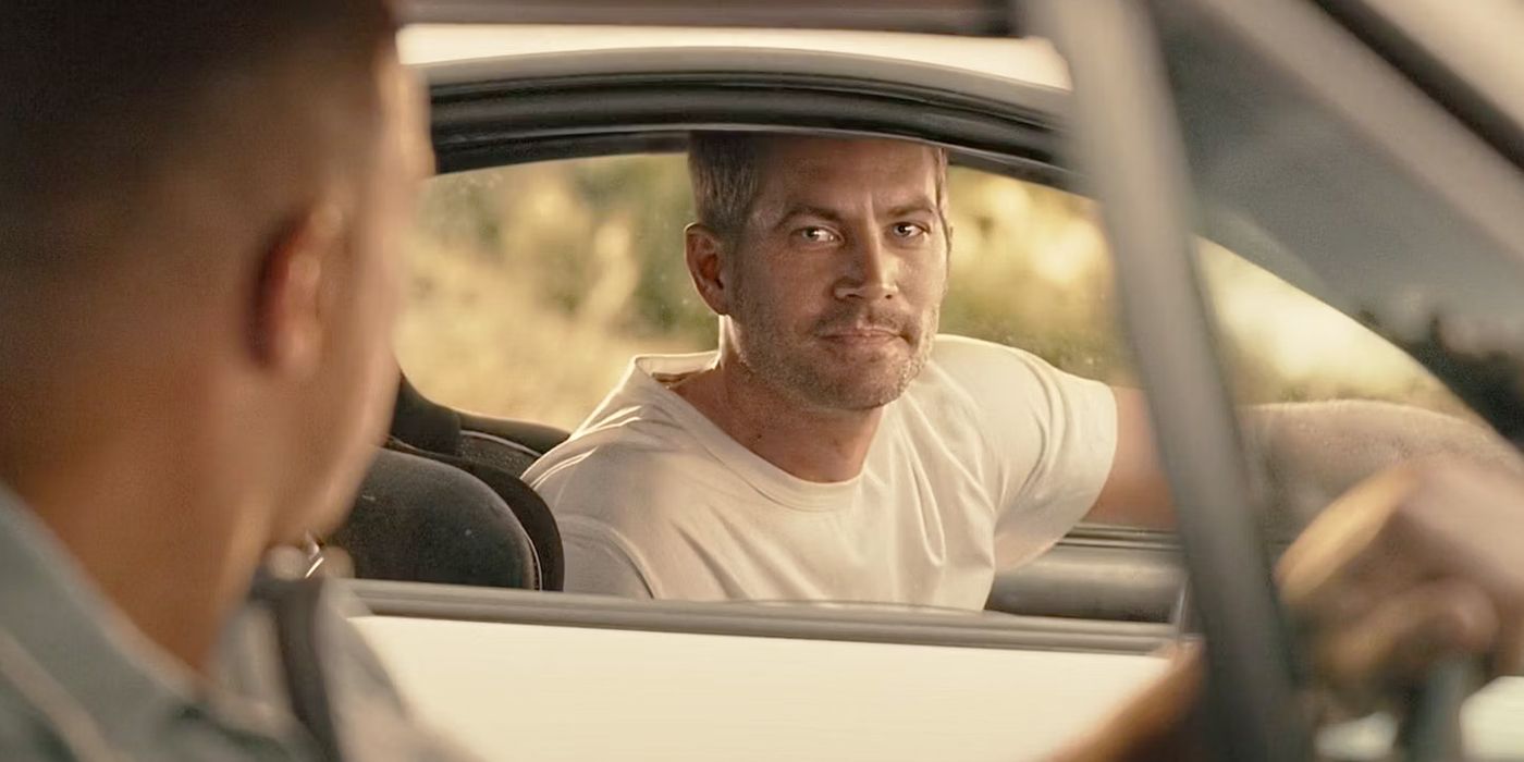 Brian O'conner (Paul Walker) in Furious 7 talking to Dom (Vin Diesel) through a car window.