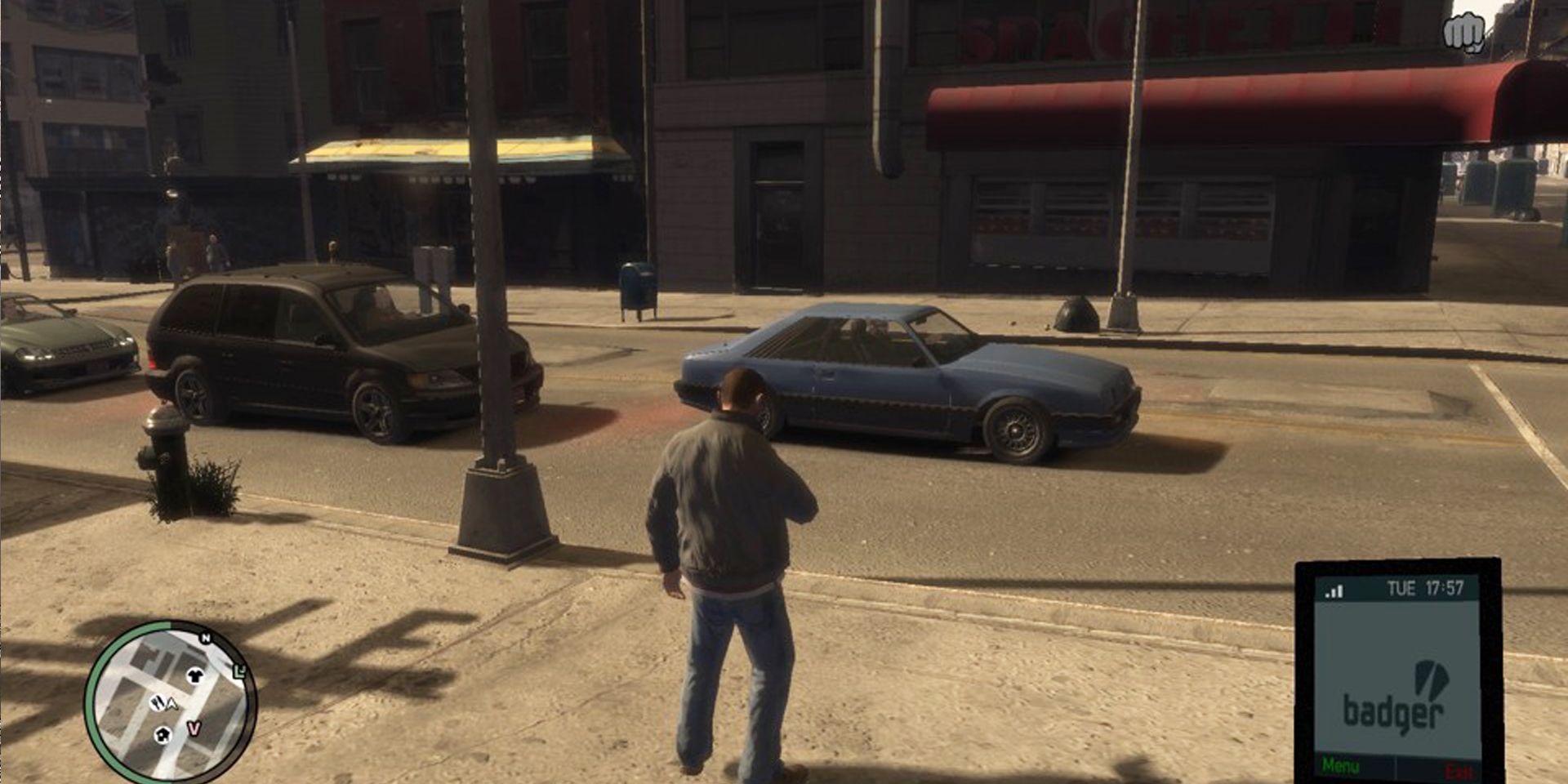 Niko Bellic uses his cell phone.