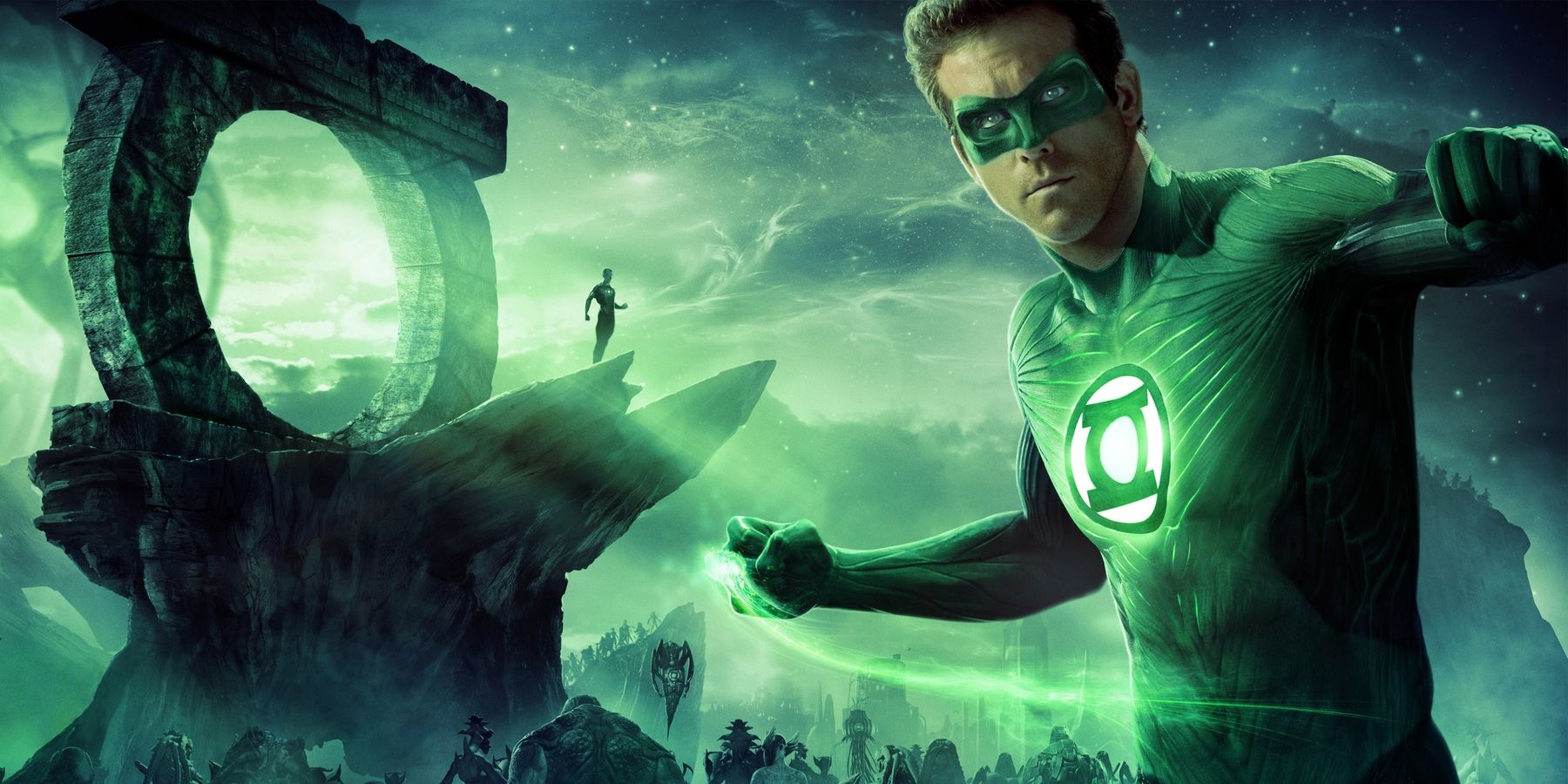 Ryan Reynolds powers up as Green Lantern, with an emerald alien world in the background.