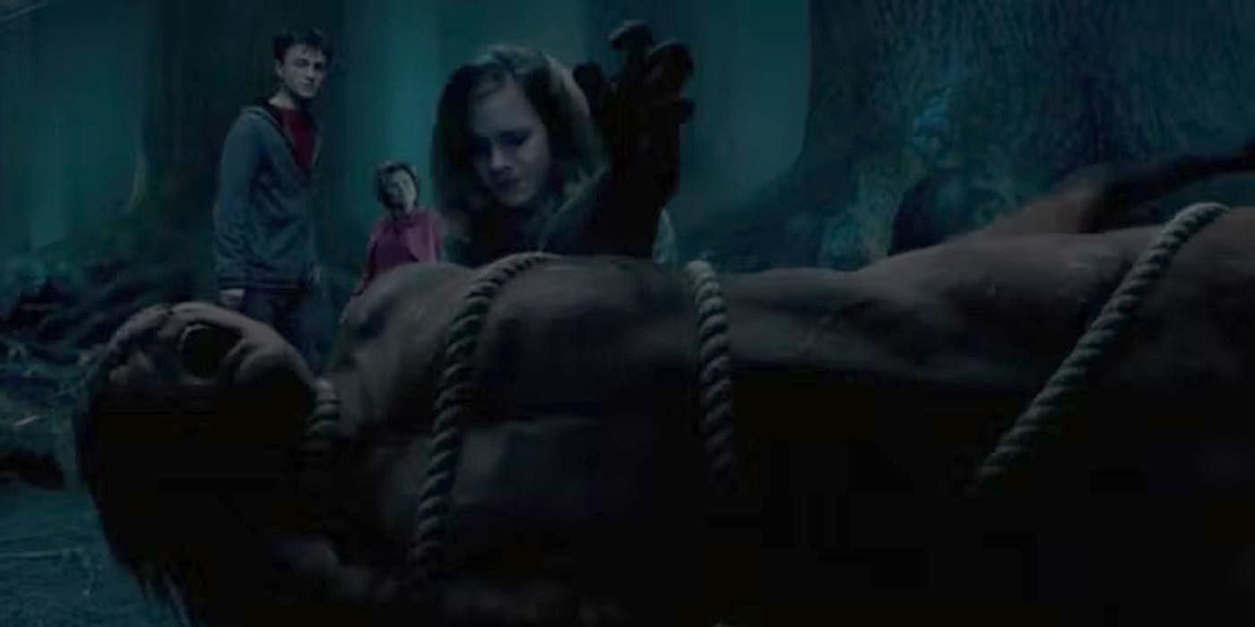 Hermione Granger helping a screaming centaur Dolores Umbridge is using Incarcerous to hold down as Harry Potter watches