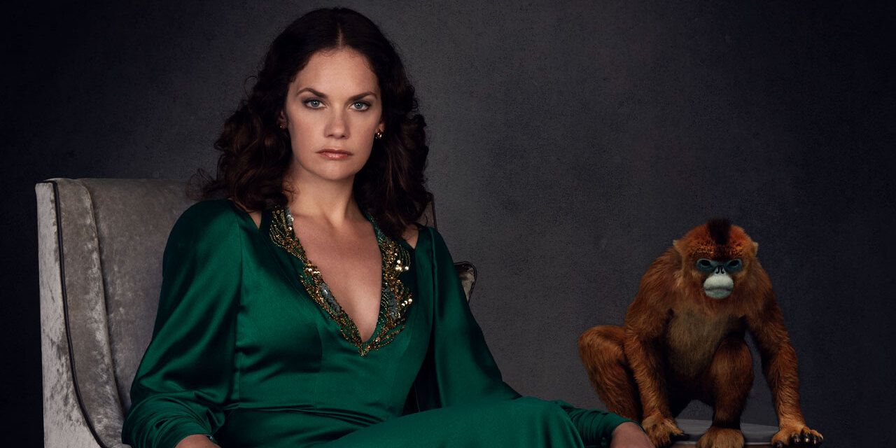 Mrs. Coulter (played by Ruth Wilson) sits next to her daemon in a promo shot for HBO's His Dark Materials.