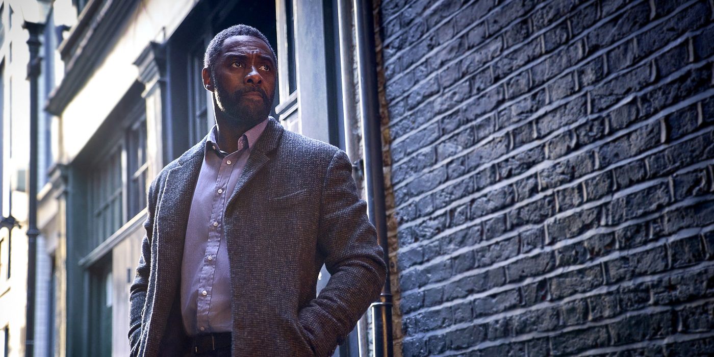 Idris Elba standing in an alley in Luther