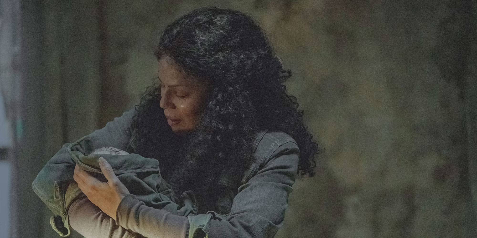 Marlene holds an infant Ellie in episode nine of HBO's The Last of Us
