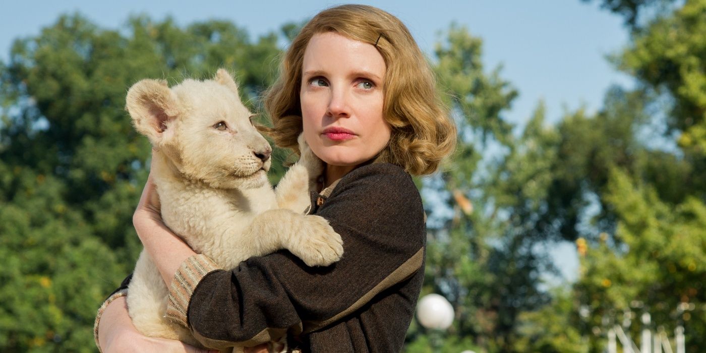 Jessica Chastain holds a lion cub in The Zookeeper's Wife 
