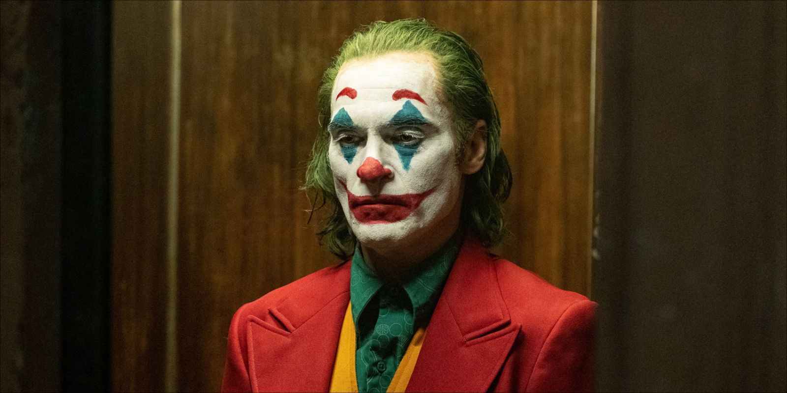 Joaquin Phoenix looking sad as The Joker