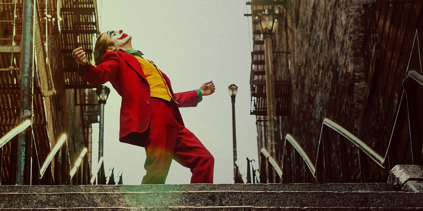 A closeup of the Joker movie poster, showing the titular character dancing in the street