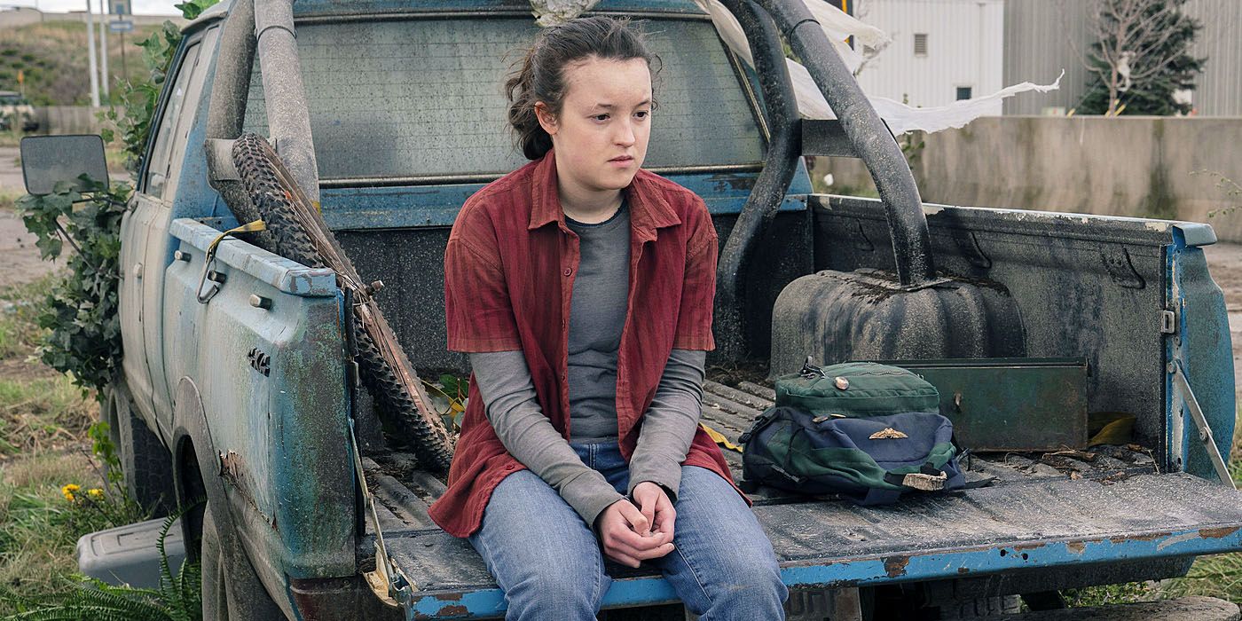 Bella Ramsey as Ellie sitting on the bed of a truck in The Last of Us Episode 9.