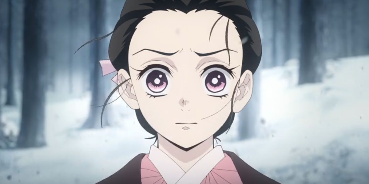 Human Nezuko Kamado with her hair up looking scared in the woods by her home in Demon Slayer.