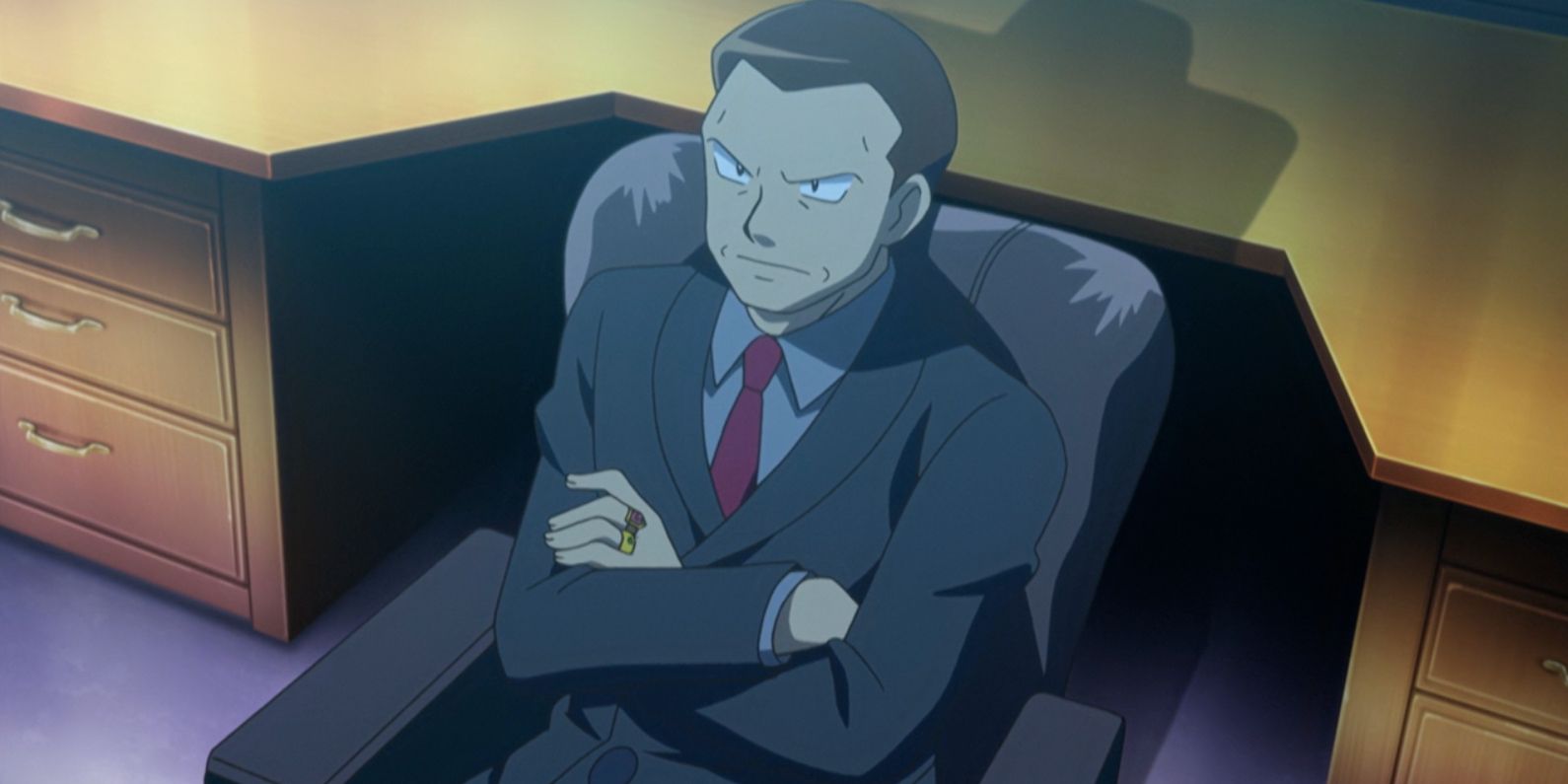 Giovanni glares sternly in his office in Pokemon
