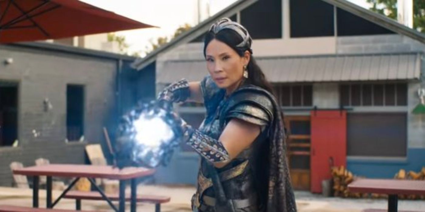 Lucy Liu holding a glowing weapon in Shazam! Fury of the Gods