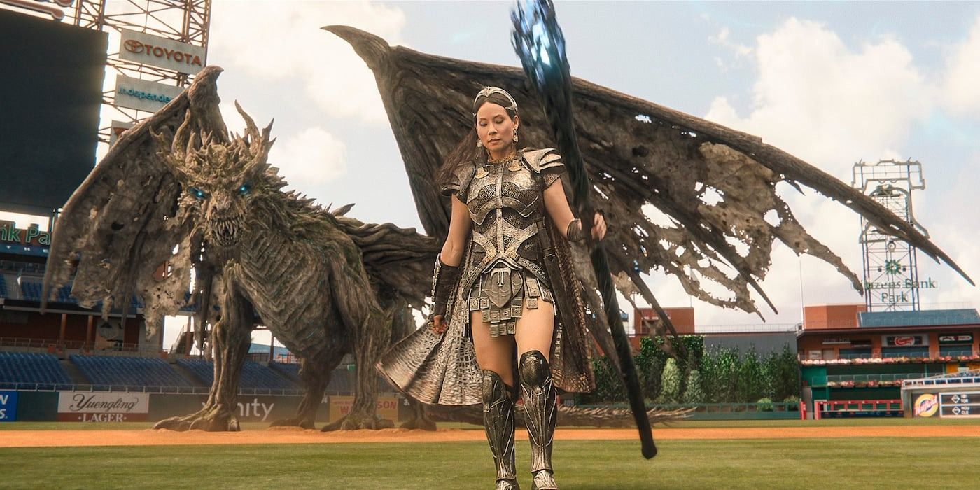 Lucy Liu as Kalypso in Shazam! Fury of the Gods with the dragon Ladon behind her