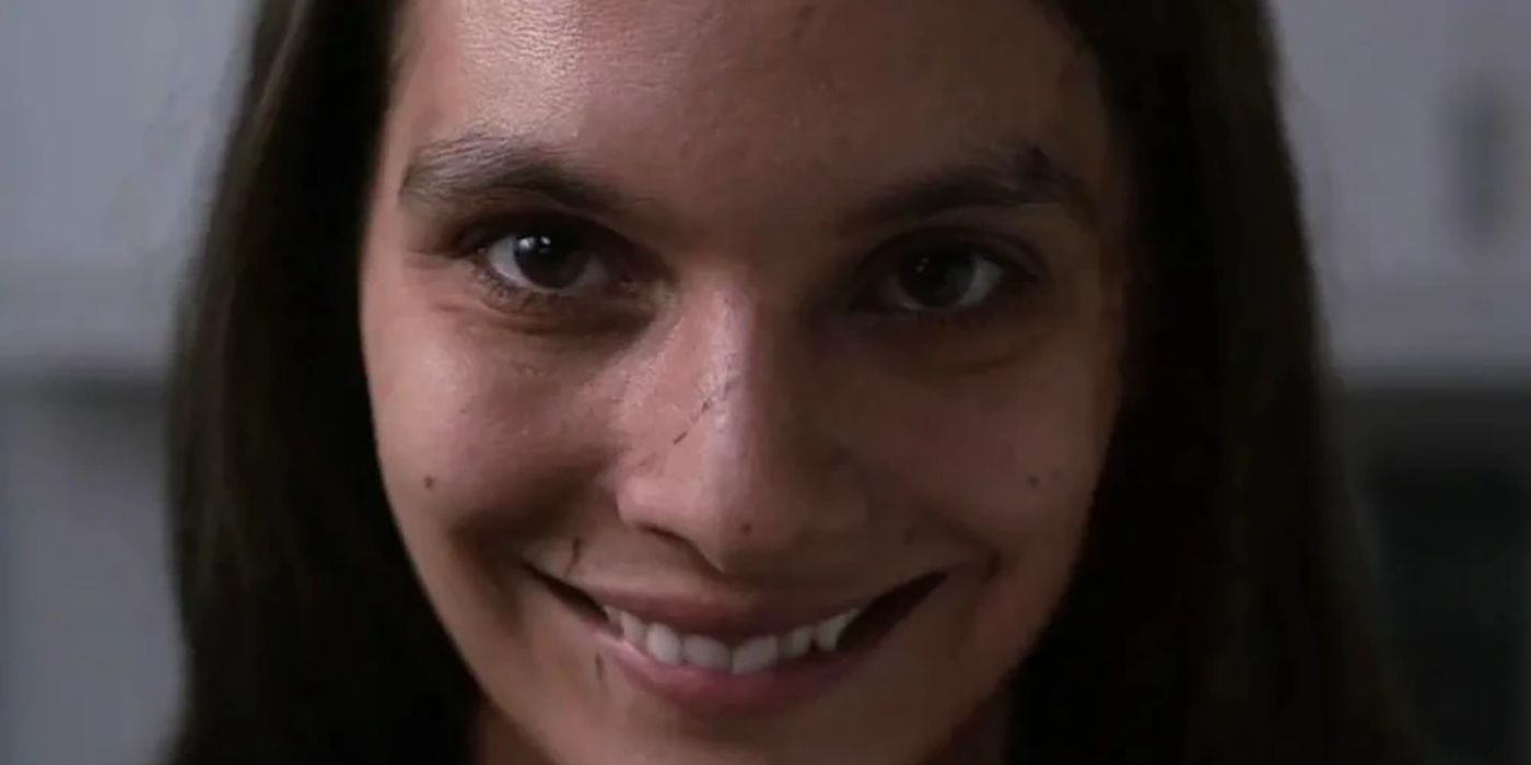 A woman with a very creepy smile in the movie Smile.