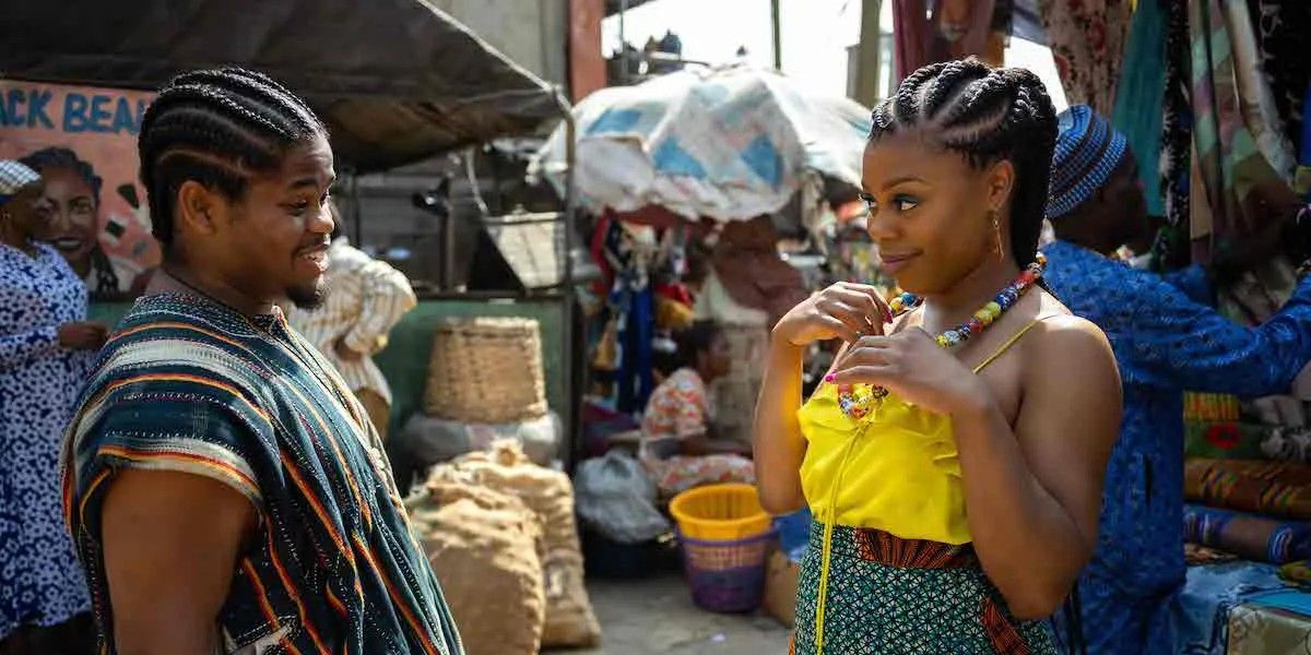 Snowfall's Leon and Wanda look at each other in a Ghanian market