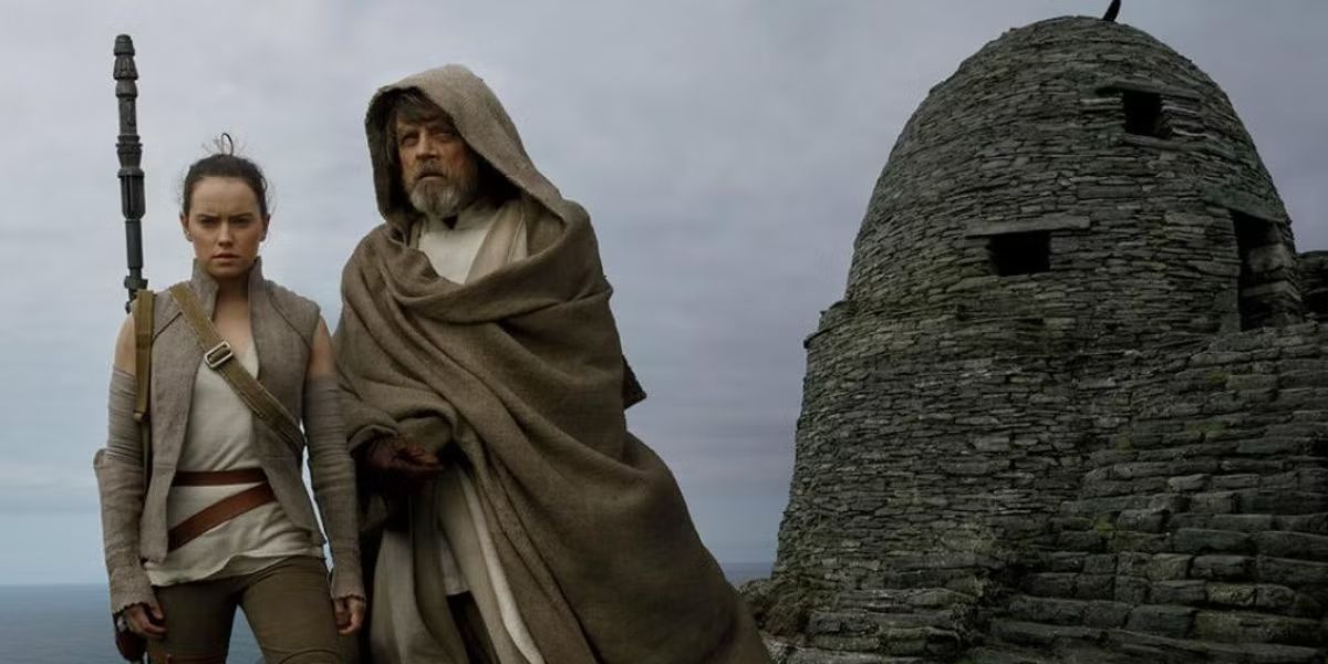 Luke Skywalker and Rey stare into the distance on Ahch-To in Star Wars the Last Jedi