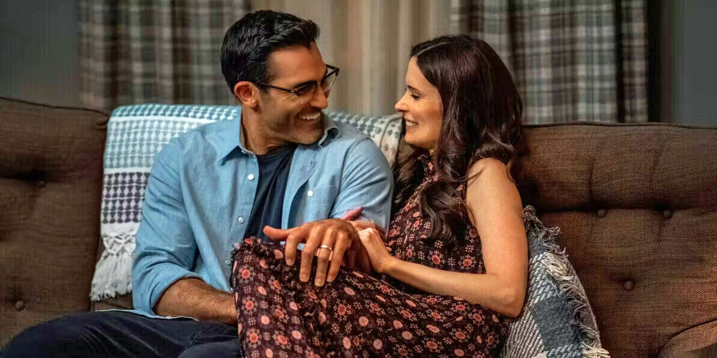 Superman & Lois: Tyler Hoechlin Elizabeth Tulloch as the titular couple sitting closely on a couch.