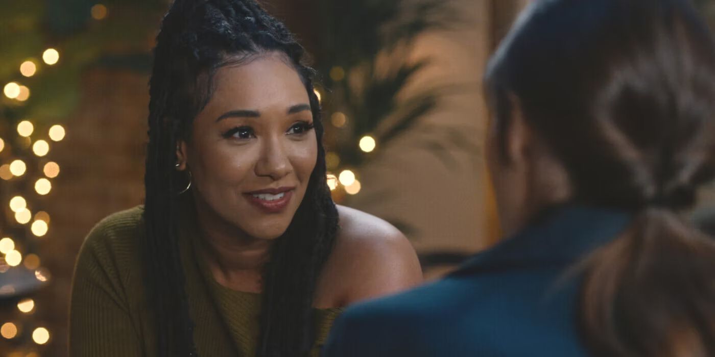 The Flash's Iris West (played by Candice Patton) smiles at Nia (Nicole Maines).