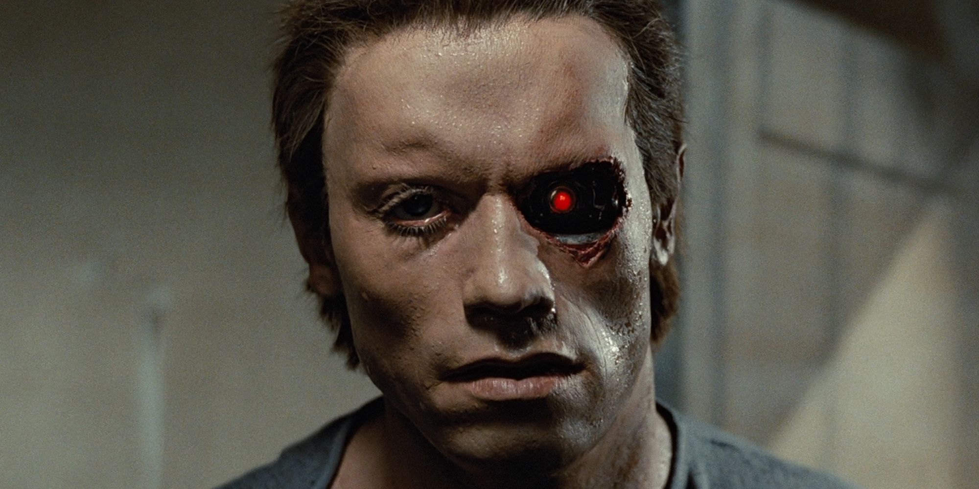The Terminator (Arnold Schwarzenegger) reveals its prosthetic face.