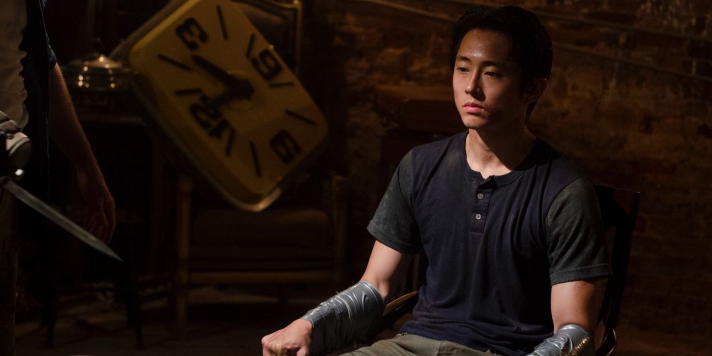 Glenn tied to a chair at Woodbury in The Walking Dead
