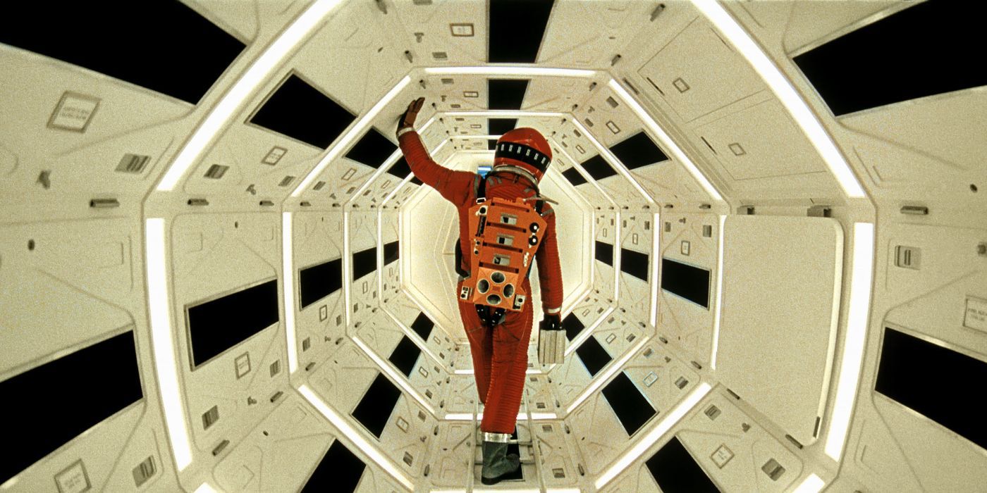 Red-suited Dr. David Bowman walking through a spaceship in 2001: A Space Odyssey 