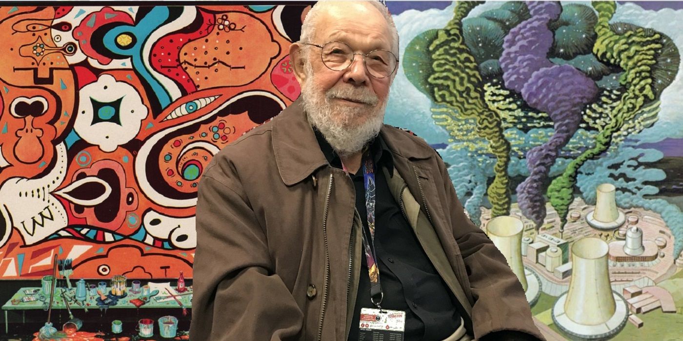 Al Jaffee in front of two of his pieces of Mad Magazine art