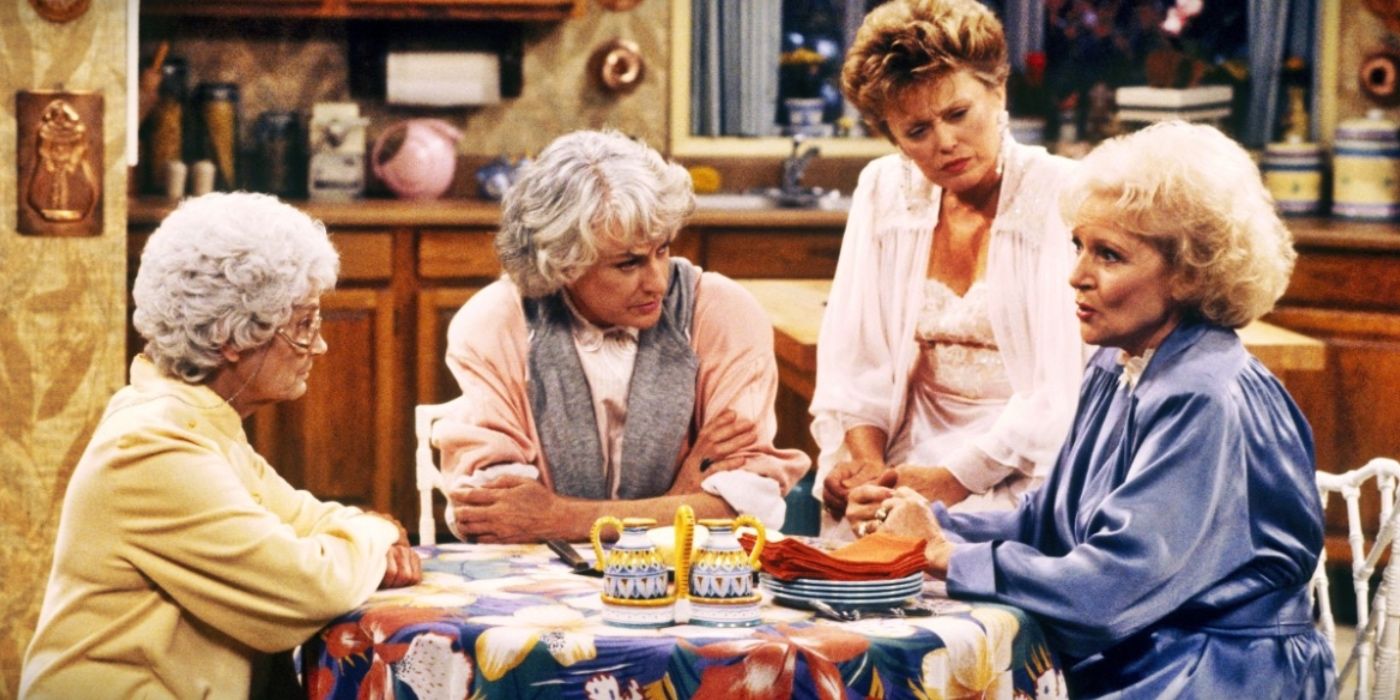 Dorothy, Blanche, and Sophia comfort Rose at the kitchen table in The Golden Girls