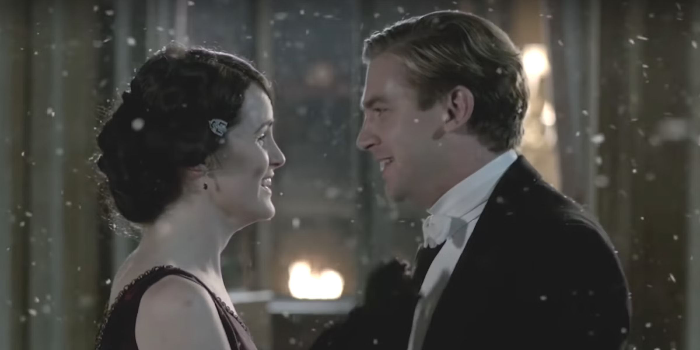 Downton Abbey's Lady Mary and Matthew (Michelle Dockery and Dan Stevens) outside in the snow.