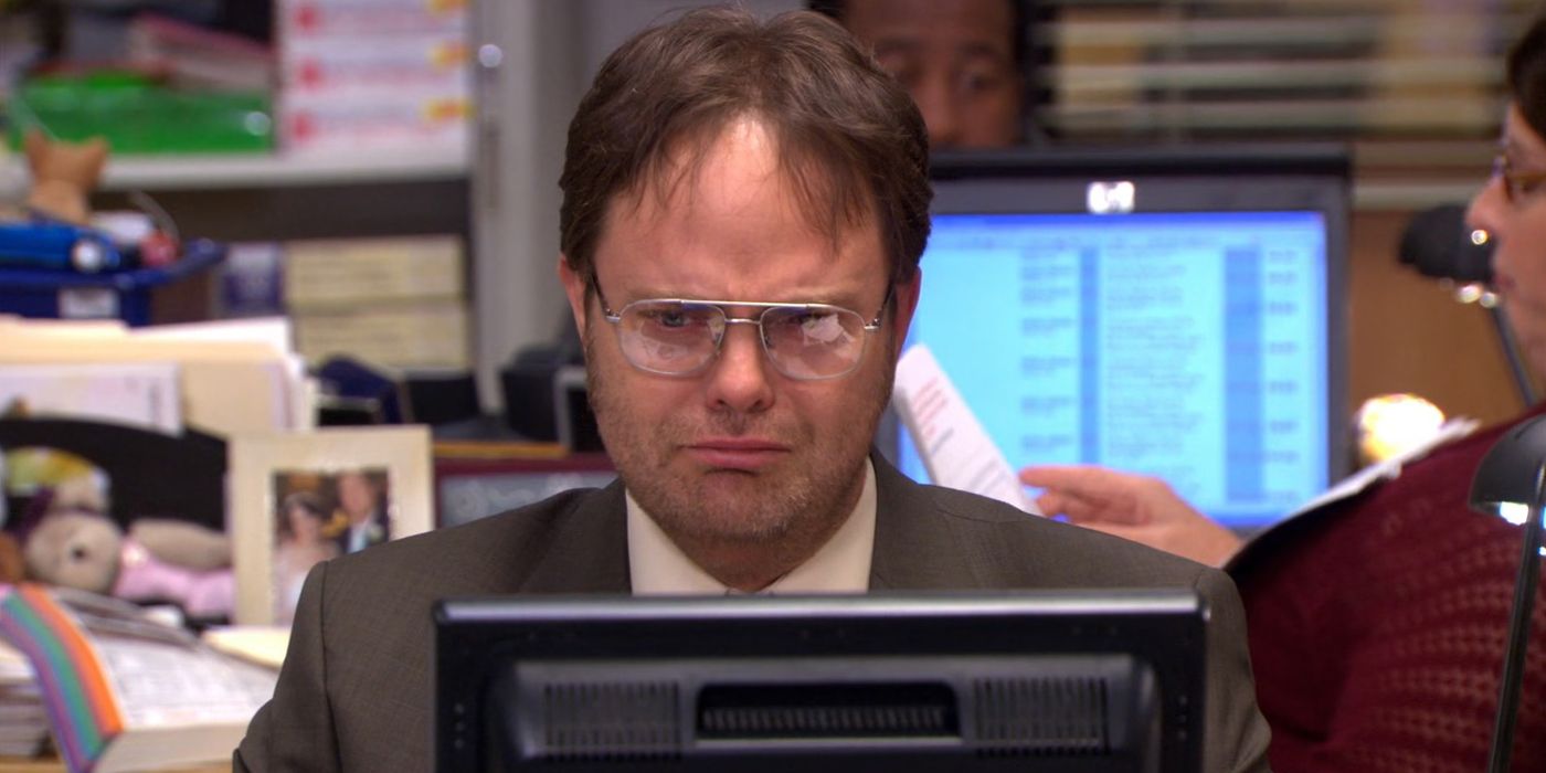 Dwight looking sad at his computer from The Office