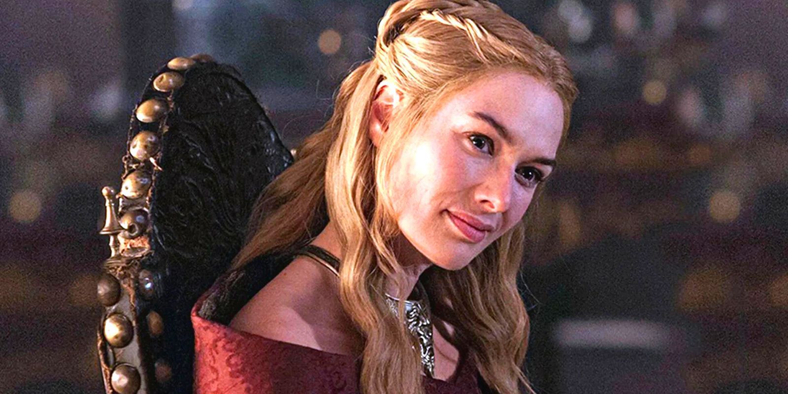 Lena Headey as Cersei Lannister, sitting in an ornate chair with her head cocked