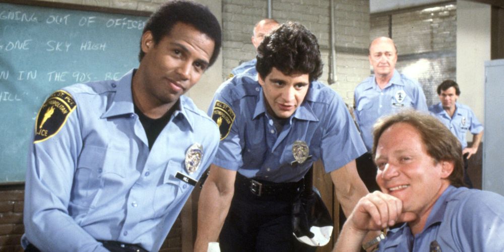 Hill Street officers crack jokes at the station in Hill Street Blues