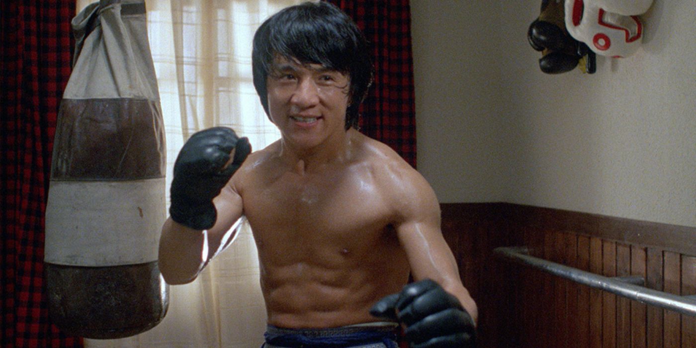 Jackie Chan's Thomas stands ready for a fight with boxing gloves on in Wheels on Meals.