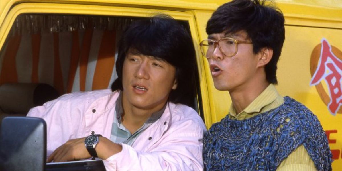 Jackie Chan in a van talking to his friend in Wheels on Meals.