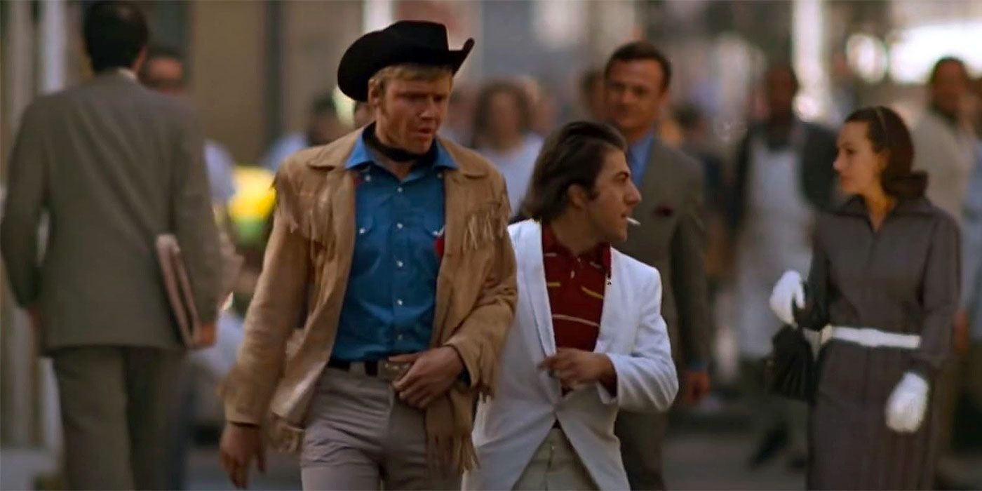 Jon Voight and Dustin Hoffman's Midnight Cowboy characters walk through a busy street