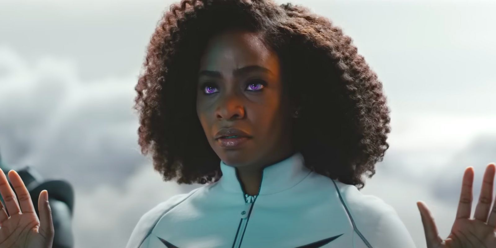 Monica Rambeau with her hands up and eyes glowing purple