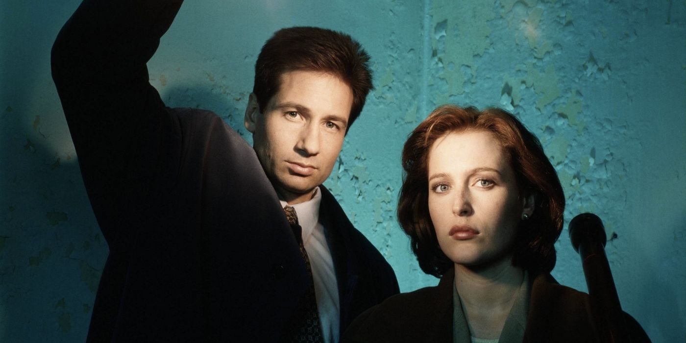 Fox Mulder and Dana Scully stand next to each other in the X-Files TV series