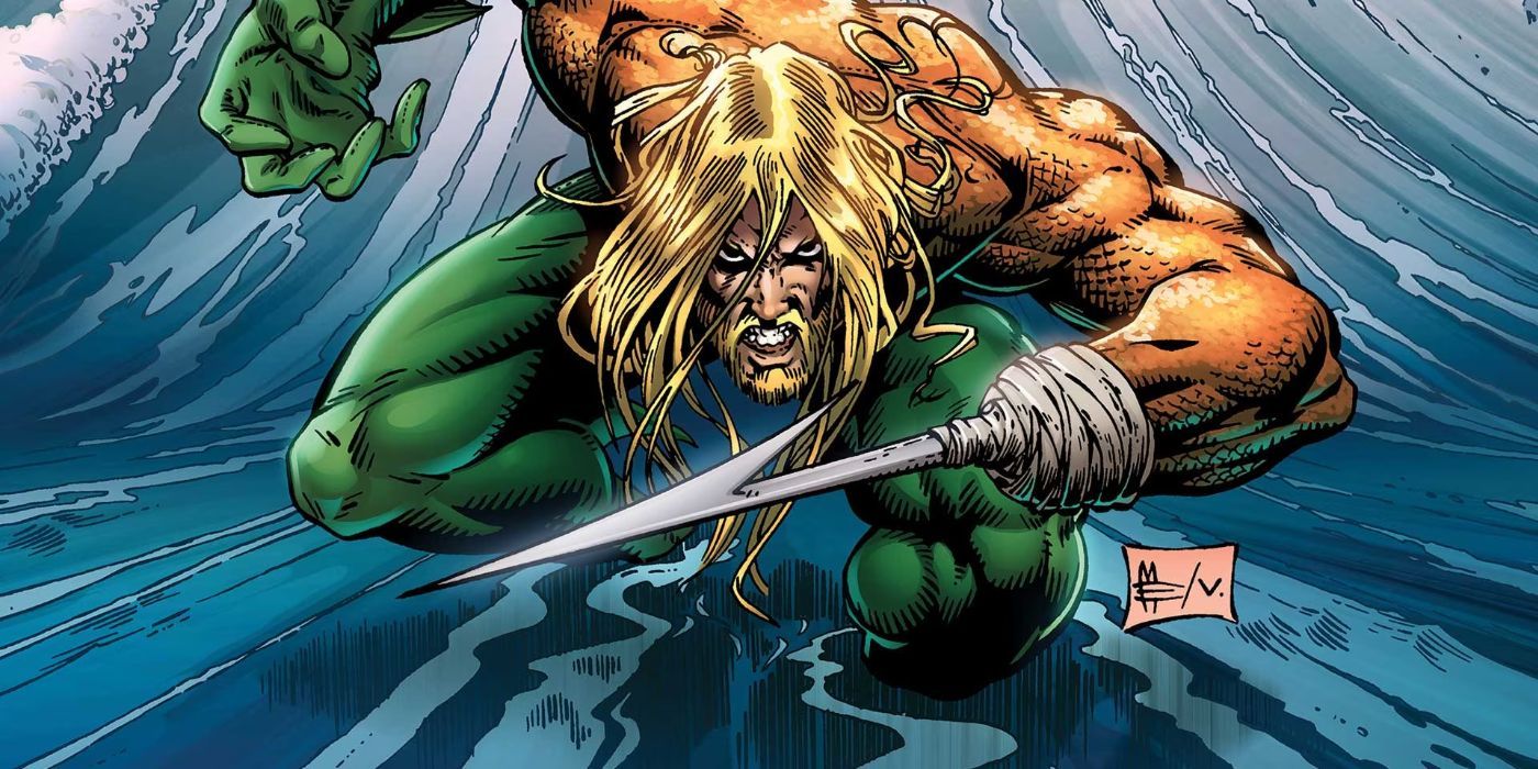 The '90s hook hand Aquaman crouching in the ocean in DC Coics