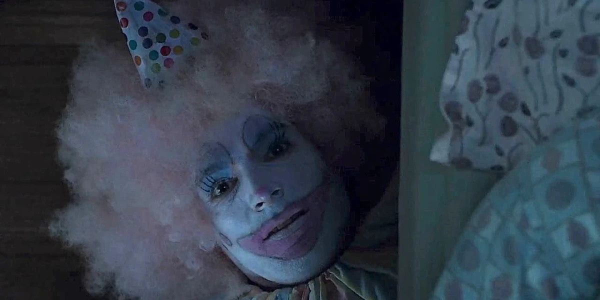 Sal Capilano dressed as a clown behind a bed in "The Capilanos" on Criminal Minds
