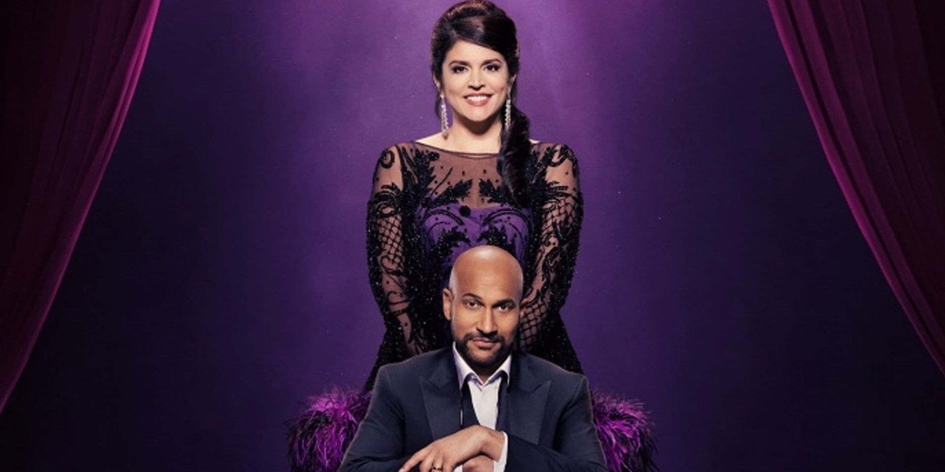 Schmigadoon!'s Keegan Michael-Key sits in front of Cecily Strong in a Season 2 promo photo.
