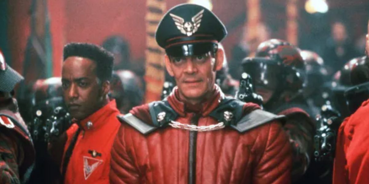 Dee Jay stands behind M. Bison in Street Fighter (1994)