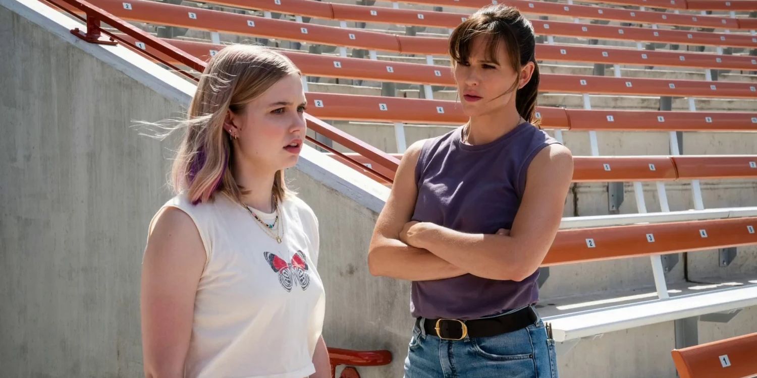 Hannah (Jennifer Garner) stands with her stepdaughter Bailey (Angourie Rice) in a football stadium
