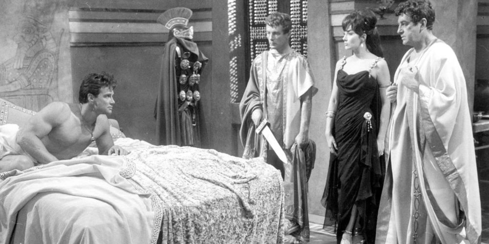 Roman guards address a man in his chambers in the black and white film The Slave (1962)