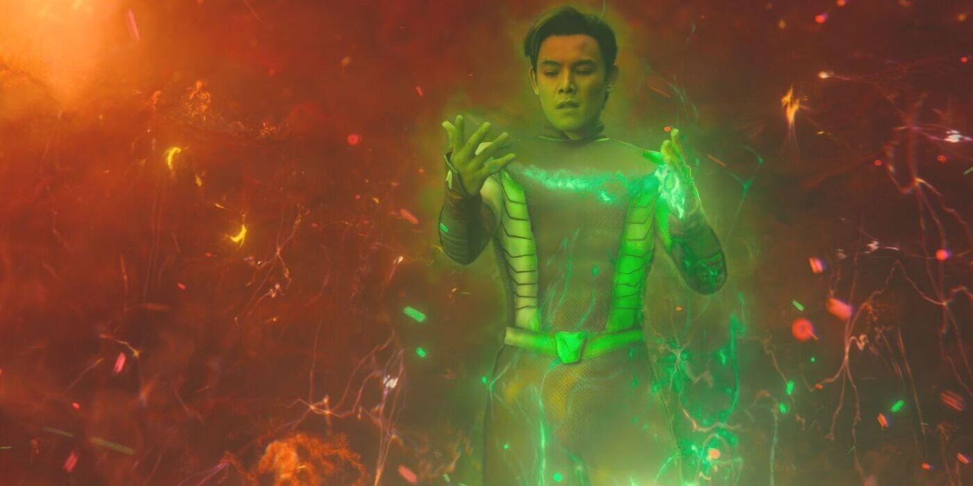 Titans Beast Boy glowing green with new powers in an orange energy space