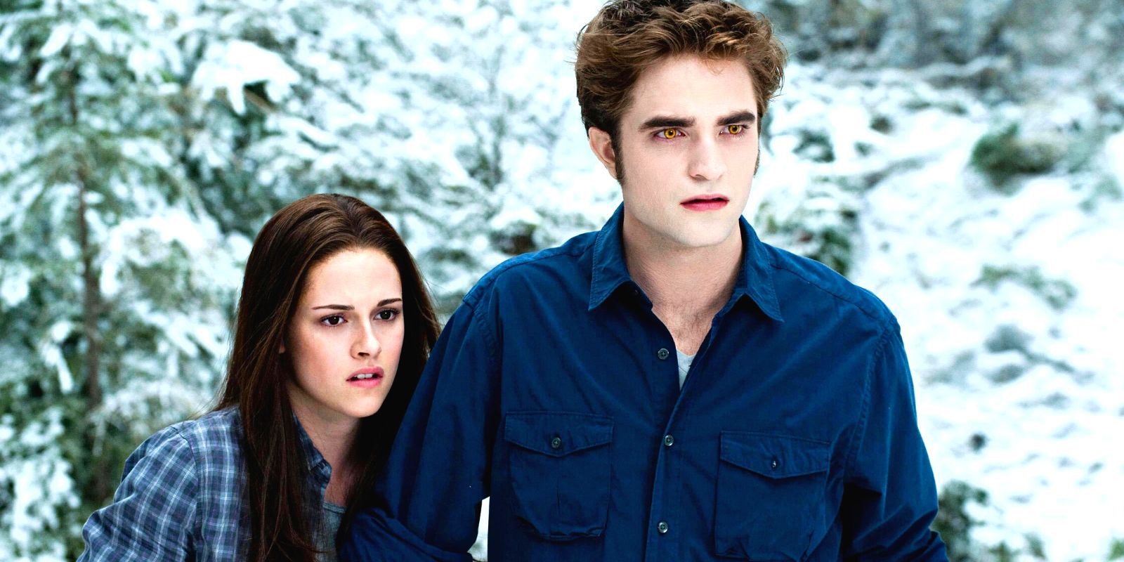 Bella and Edward looking aghast at something while standing in a snowy forest