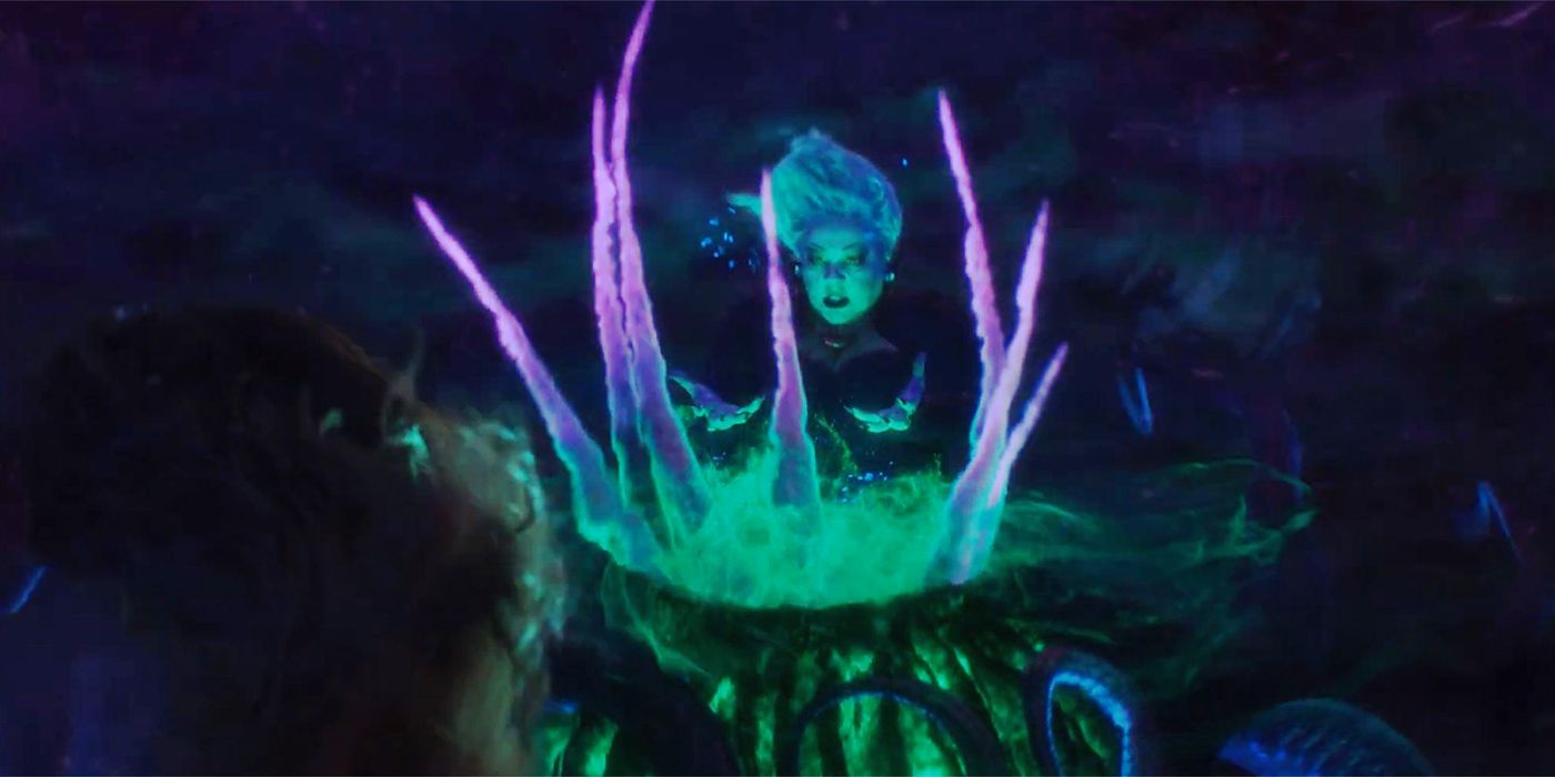 Ursula (Melissa McCarthy) behind a colorful cauldron in Little Mermaid remake.