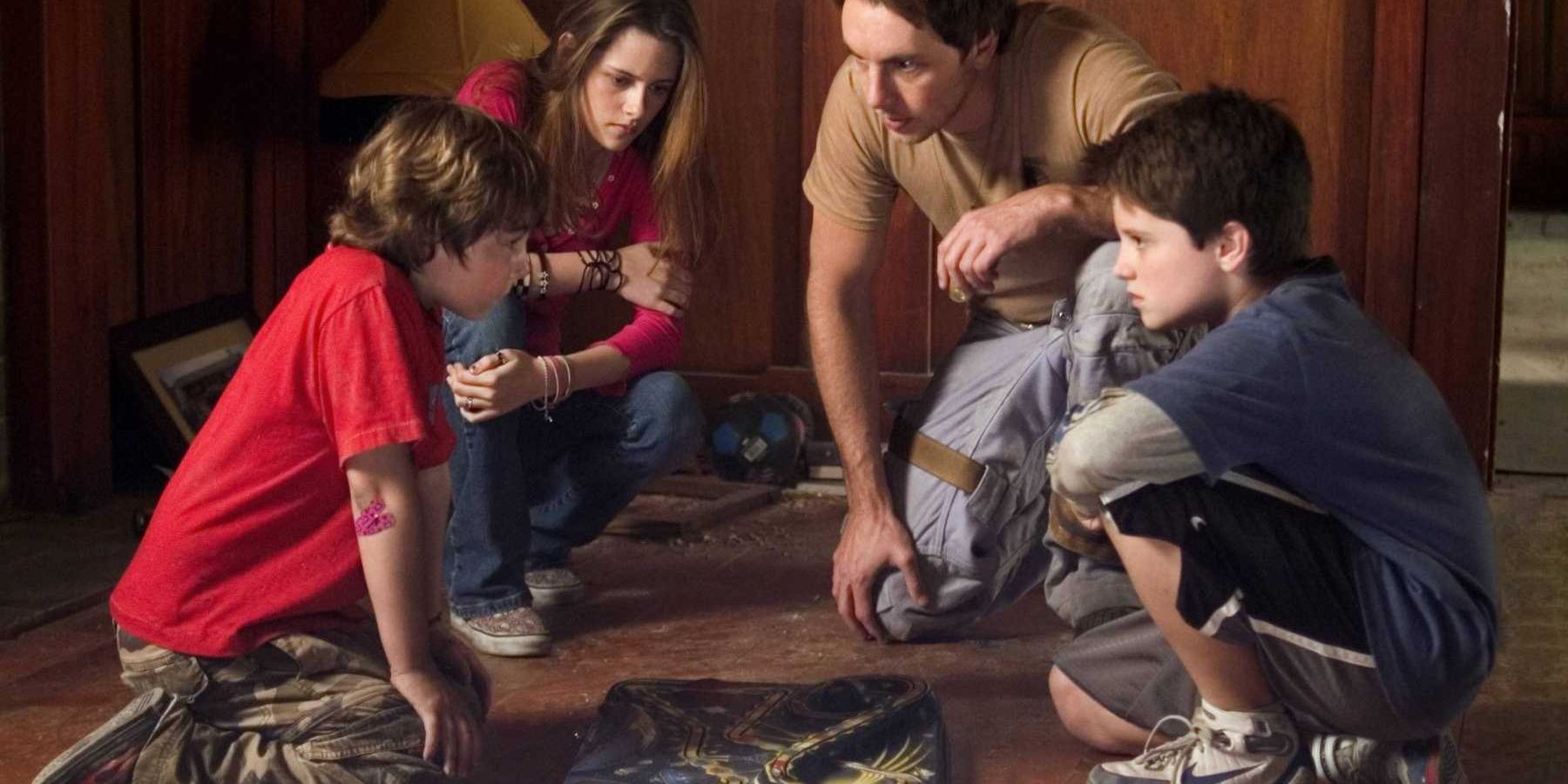 Walter, Danny, Lisa and the astronaut playing Zathura the board game