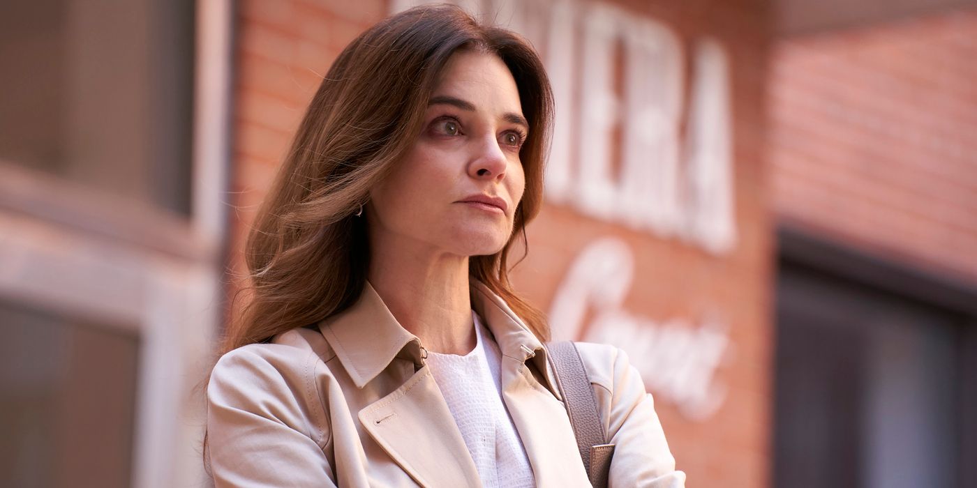 Accused's Kara, played by Betsy Brandt, looks expectant outside of her apartment building