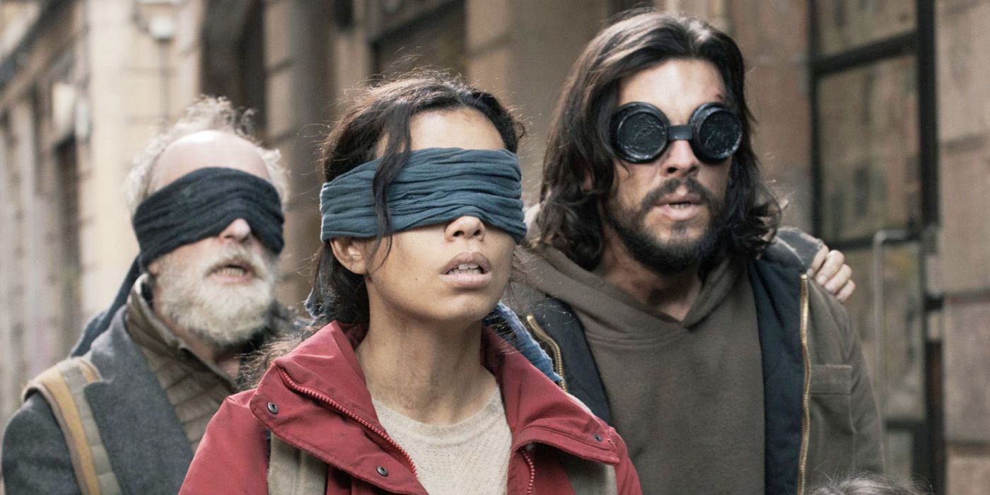 Three blindfolded humans navigate the streets of Barcelona.