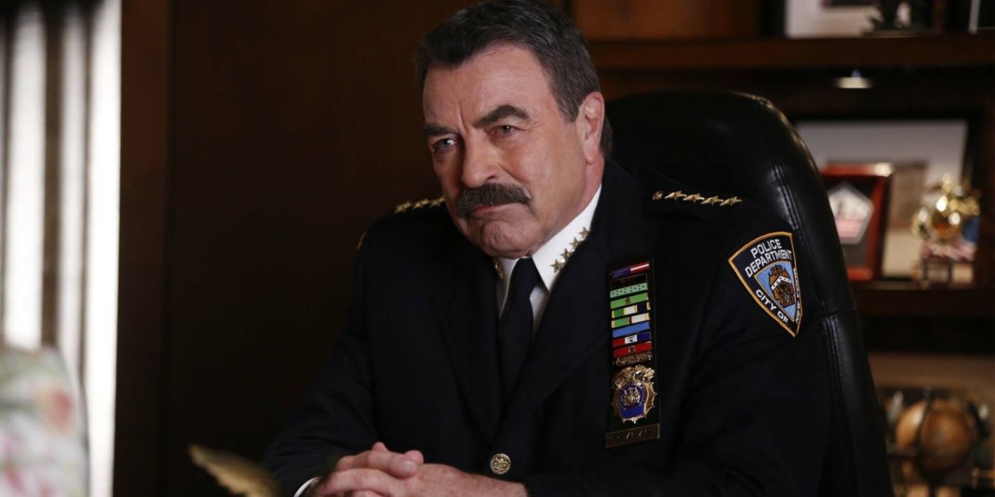 Frank Reagan sitting at his desk in a dress uniform in Blue Bloods